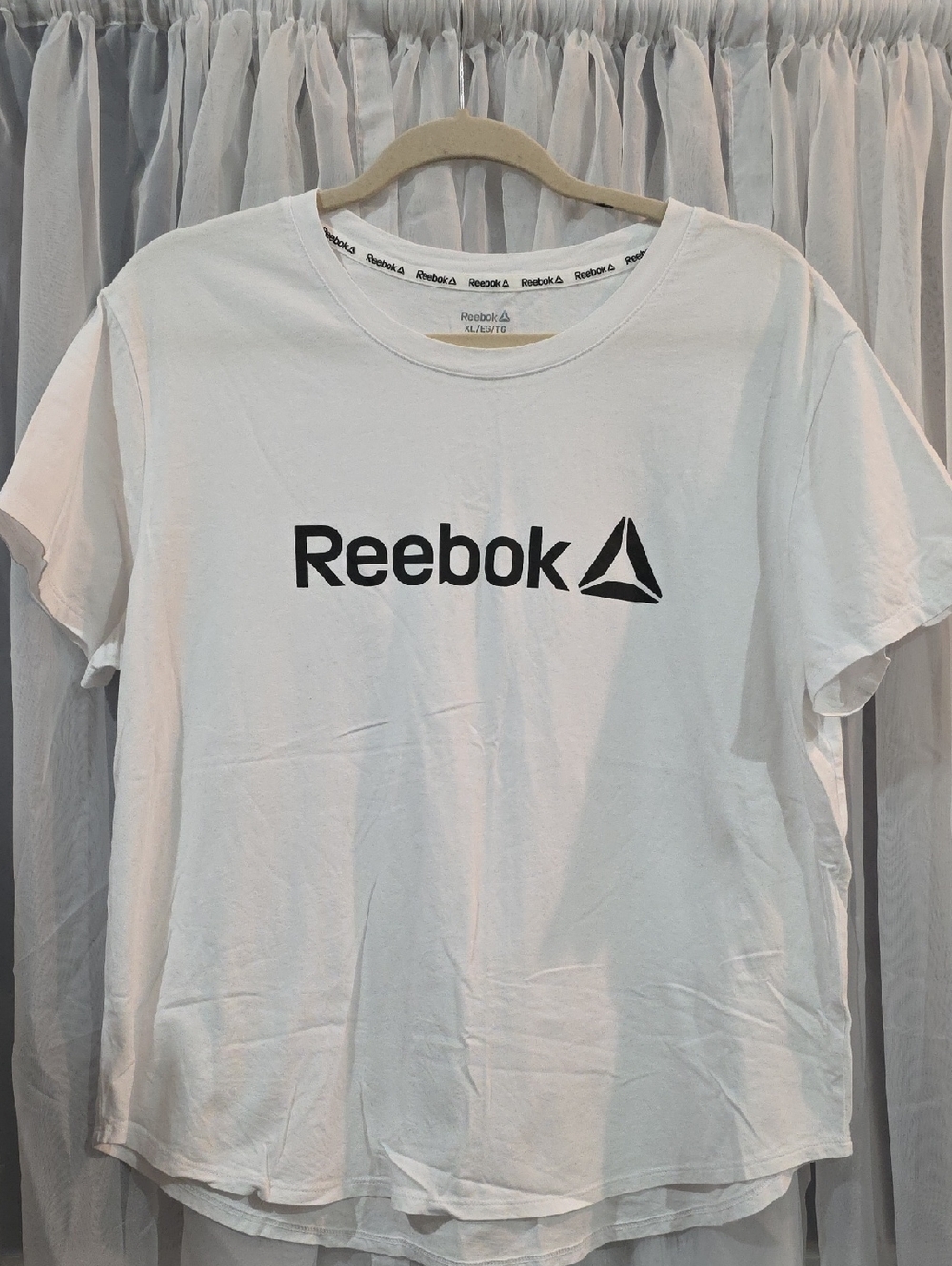 #212 Womens Reebok White Short Sleeve Logo Tee with Black Chest Marking